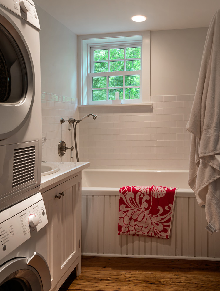Elegant bathroom/laundry room photo in New York with a drop-in sink