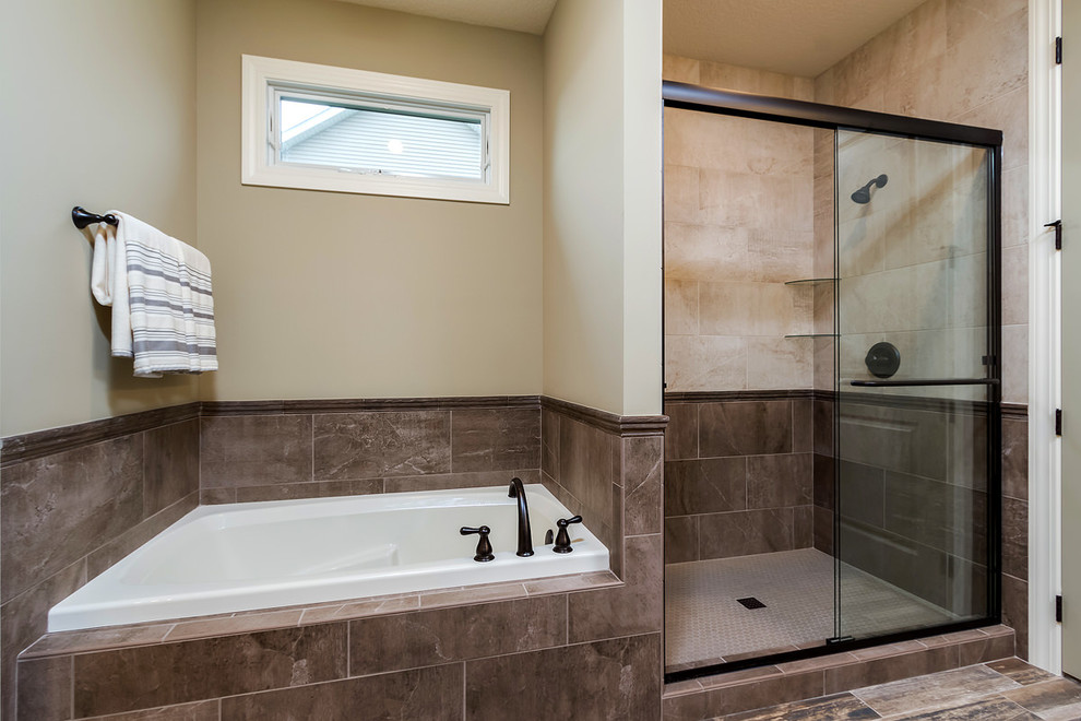 Medium sized classic ensuite bathroom in Chicago with recessed-panel cabinets, dark wood cabinets, an alcove bath, an alcove shower, beige tiles, ceramic tiles, brown walls, porcelain flooring, a submerged sink, granite worktops, brown floors and a sliding door.