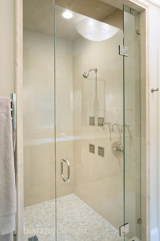 Example of a mid-sized classic master beige tile and stone tile porcelain tile alcove shower design in Charlotte with an undermount sink, recessed-panel cabinets, granite countertops and beige walls