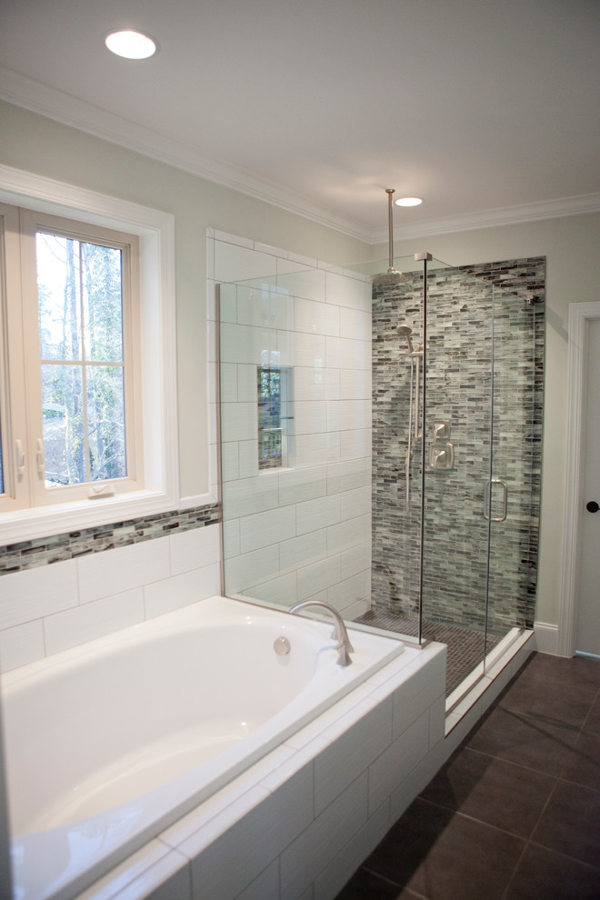 Photo of a large contemporary ensuite bathroom in Raleigh with a corner bath, a corner shower, grey tiles and glass tiles.