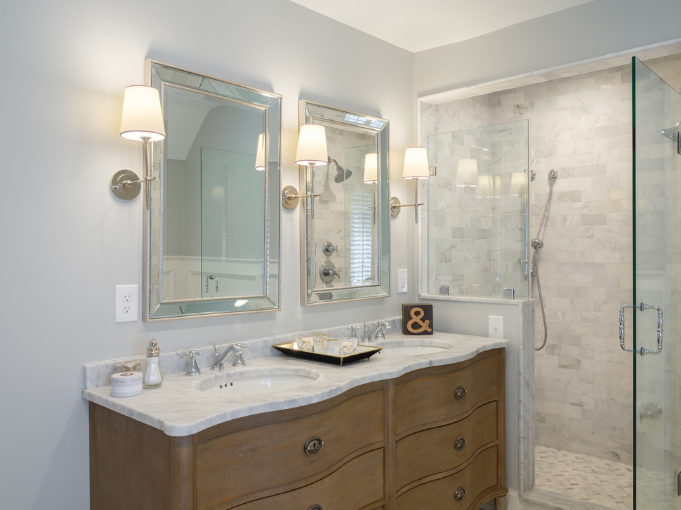 Inspiration for a mid-sized timeless kids' white tile and marble tile marble floor and white floor bathroom remodel in Philadelphia with furniture-like cabinets, light wood cabinets, gray walls, an undermount sink, marble countertops, a hinged shower door and a two-piece toilet