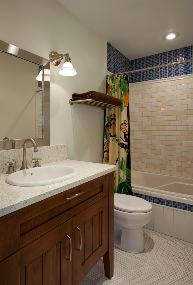 This is an example of a small traditional shower room bathroom in Salt Lake City with a built-in sink, freestanding cabinets, light wood cabinets, solid surface worktops, a built-in bath, a shower/bath combination, ceramic tiles, white walls and ceramic flooring.