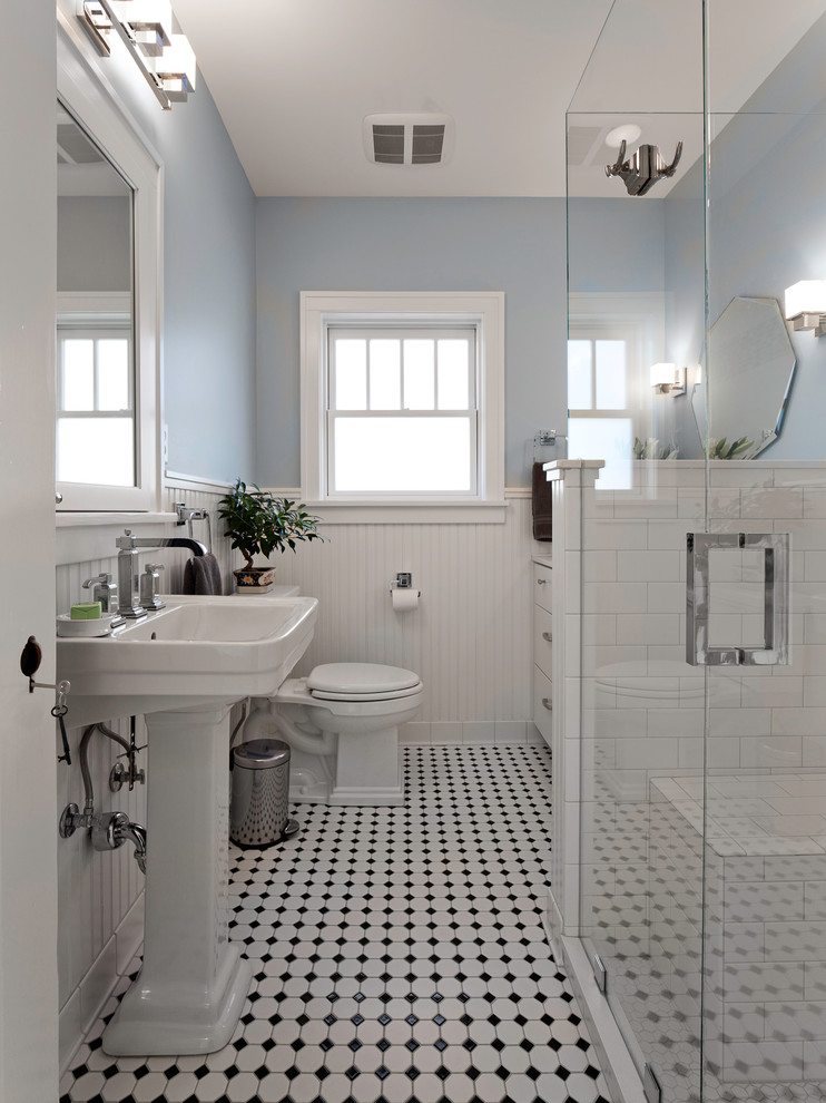 Inspiration for a victorian white tile and subway tile ceramic tile and multicolored floor bathroom remodel in Other with a pedestal sink, flat-panel cabinets, white cabinets, a two-piece toilet and blue walls