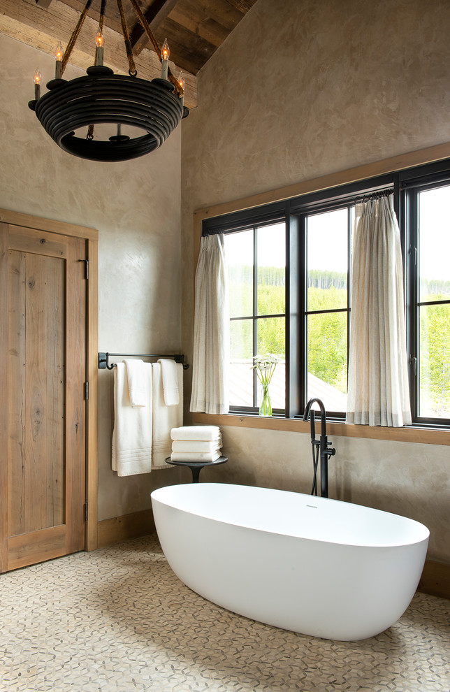 Mid-sized mountain style master mosaic tile floor and beige floor freestanding bathtub photo in Other with beige walls