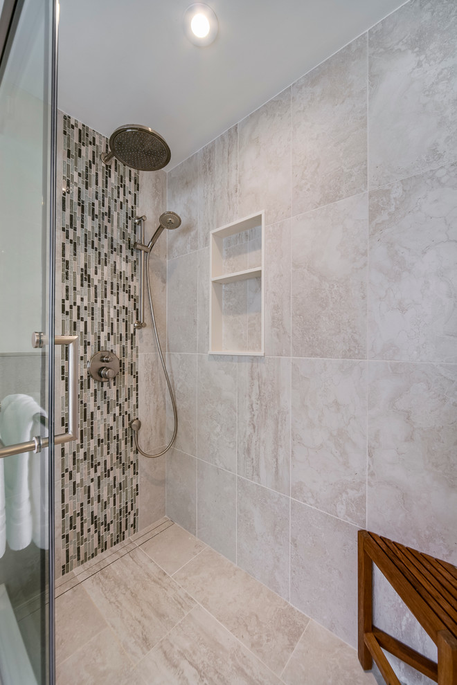Large trendy master multicolored tile and mosaic tile porcelain tile and beige floor corner shower photo in Toronto with raised-panel cabinets, white cabinets, white walls, an undermount sink, solid surface countertops and a hinged shower door