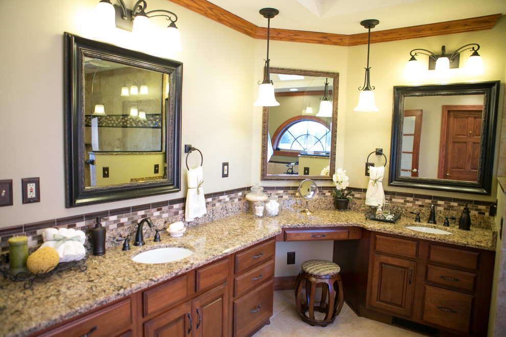 Example of a large classic master beige tile and ceramic tile ceramic tile bathroom design in Indianapolis with an undermount sink, raised-panel cabinets, dark wood cabinets, quartz countertops, a two-piece toilet and beige walls