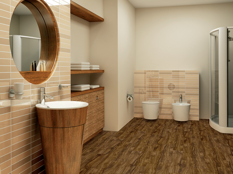 Mid-sized trendy master beige tile and porcelain tile mosaic tile floor and brown floor bathroom photo in Montreal with flat-panel cabinets, brown cabinets, a wall-mount toilet, gray walls and a pedestal sink