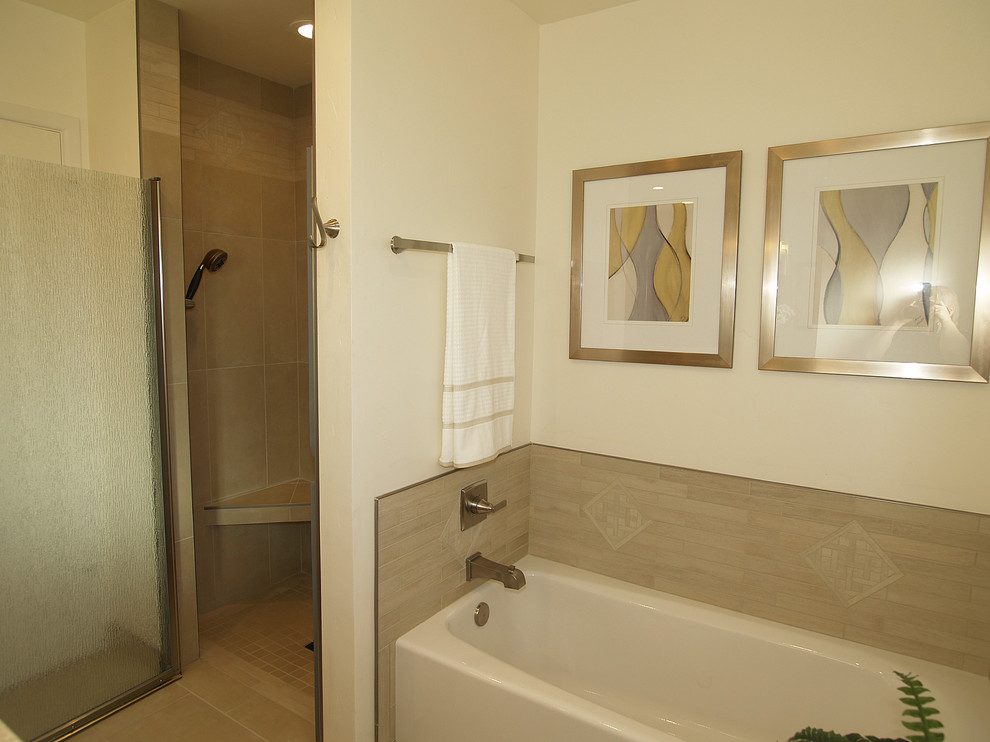 Example of a small trendy master beige tile and porcelain tile porcelain tile bathroom design in Sacramento with flat-panel cabinets, light wood cabinets, a one-piece toilet, white walls, an undermount sink and solid surface countertops