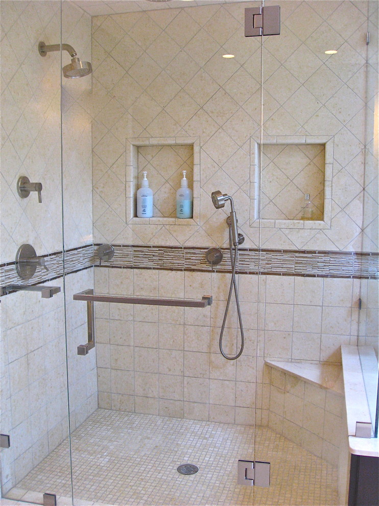 Tub/shower combo - mid-sized traditional master beige tile and stone tile medium tone wood floor tub/shower combo idea in Boston with an undermount sink, flat-panel cabinets, dark wood cabinets, marble countertops, an undermount tub, a two-piece toilet and beige walls