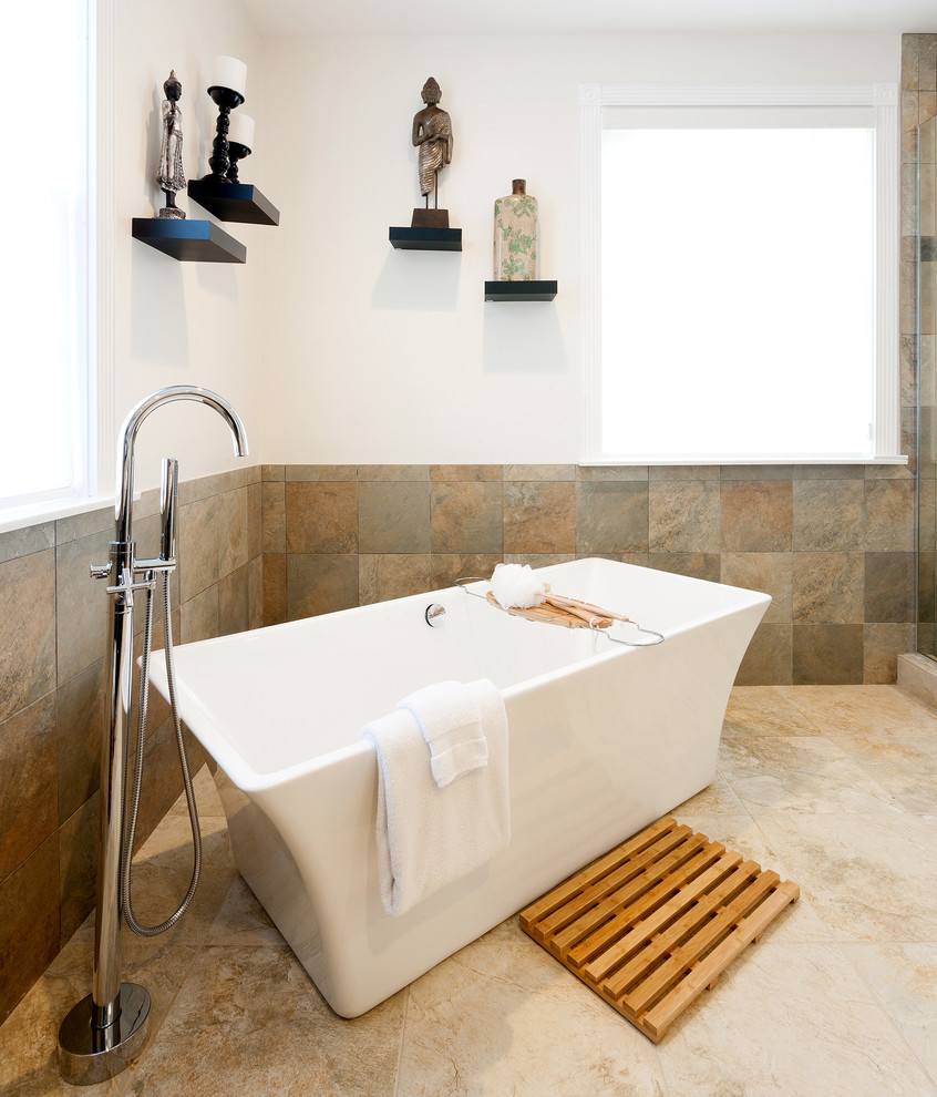Freestanding bathtub - eclectic freestanding bathtub idea in Los Angeles with beige walls