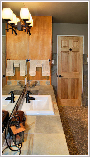 Example of a mid-sized transitional master brown tile and gray tile pebble tile floor and brown floor bathroom design in Portland with a drop-in sink, raised-panel cabinets, light wood cabinets, a one-piece toilet and gray walls