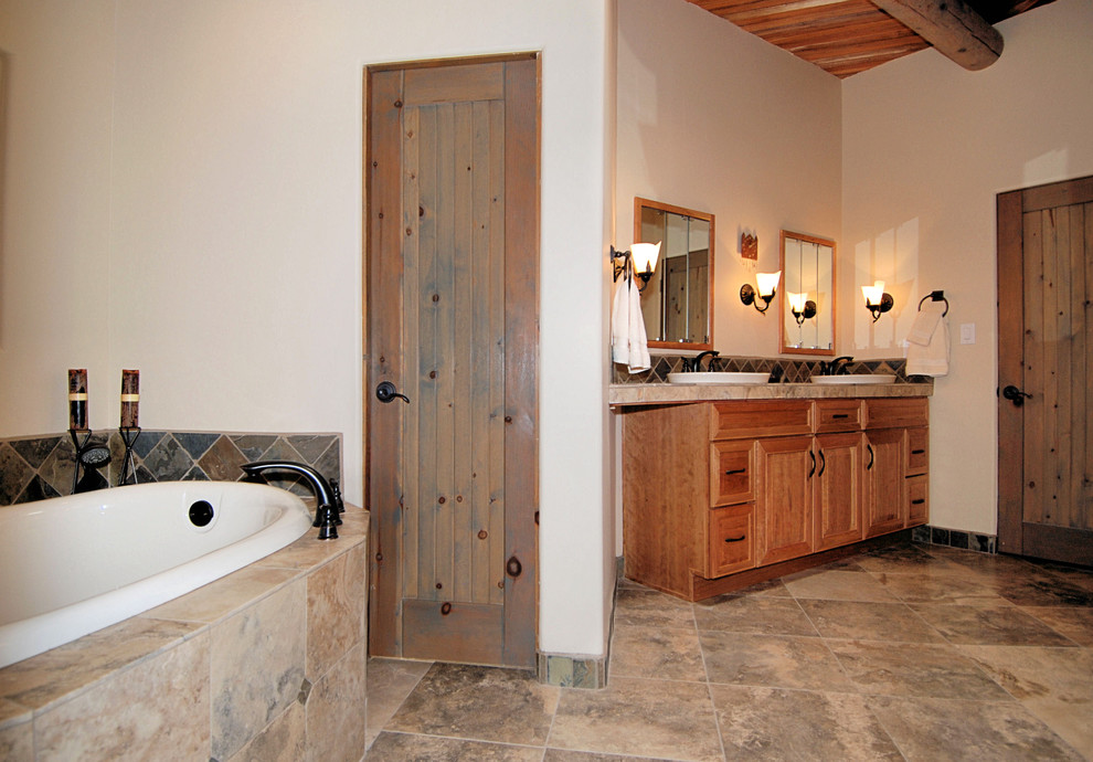 Bathroom - mid-sized craftsman master slate tile bathroom idea in Portland with raised-panel cabinets, a one-piece toilet, white walls, a drop-in sink, a hinged shower door and medium tone wood cabinets