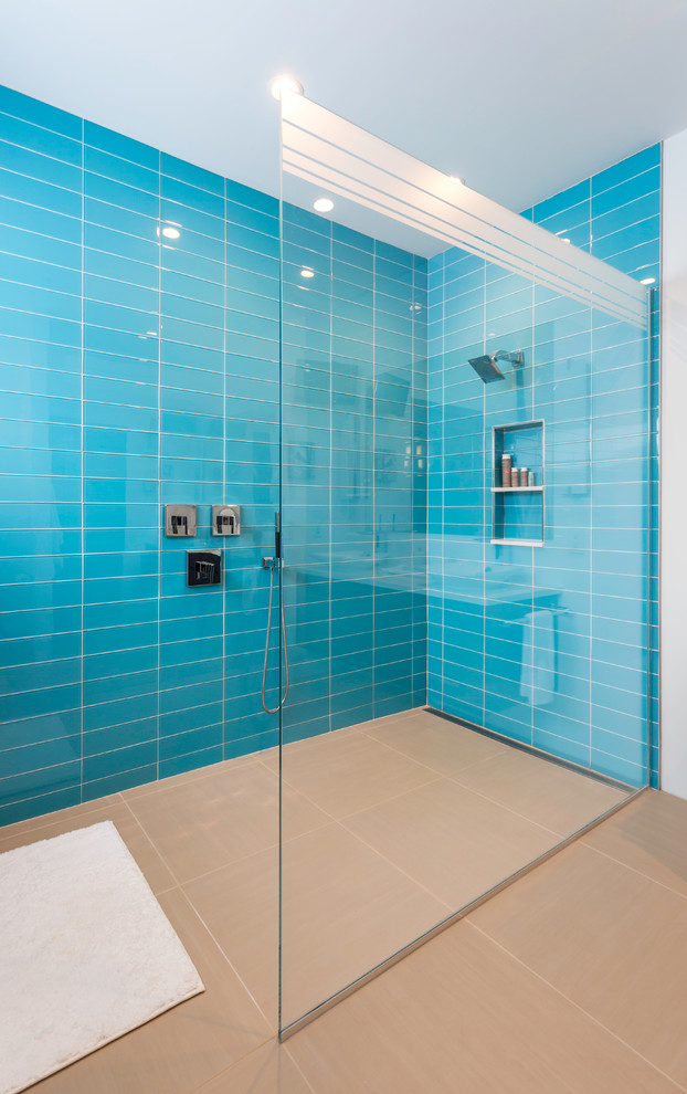 Inspiration for a midcentury bathroom in Boston with blue tiles.