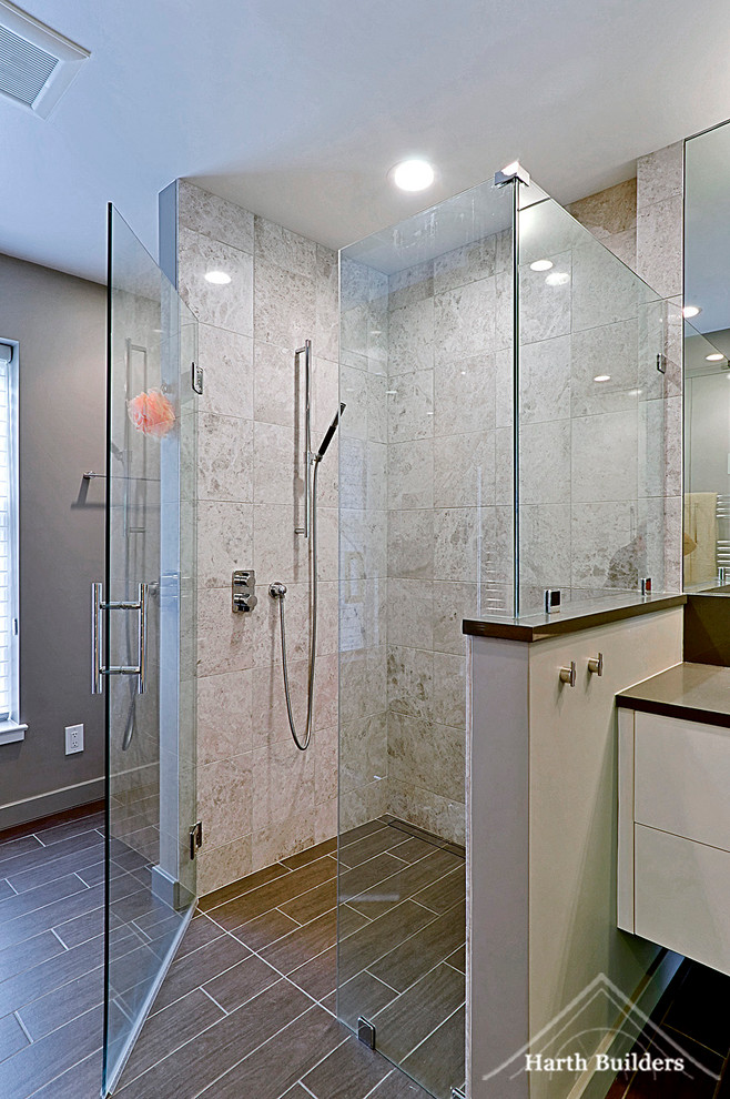 Large contemporary ensuite bathroom in Philadelphia with a vessel sink, freestanding cabinets, white cabinets, engineered stone worktops, a walk-in shower, a two-piece toilet, grey tiles, porcelain tiles, grey walls and porcelain flooring.