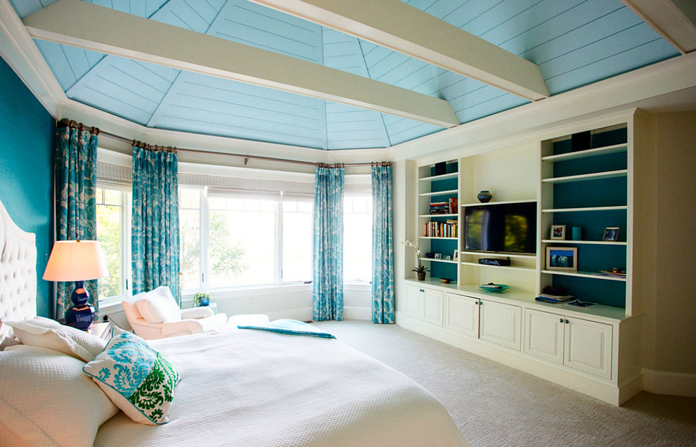 Example of a large beach style master carpeted bedroom design in Baltimore with blue walls
