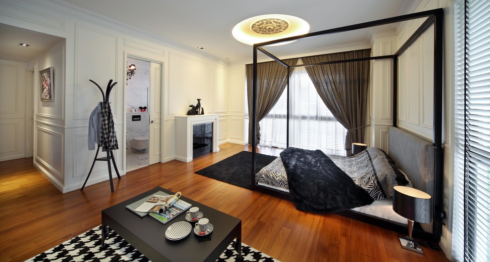 Design ideas for a contemporary cream and black bedroom in Singapore with white walls.