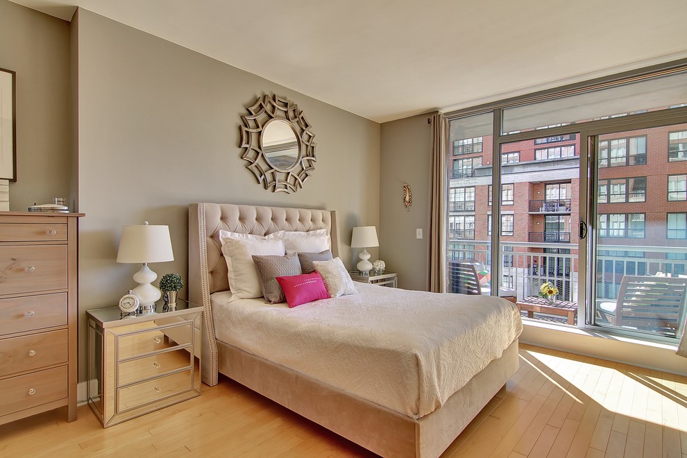 Mid-sized transitional master light wood floor bedroom photo in New York with gray walls and no fireplace