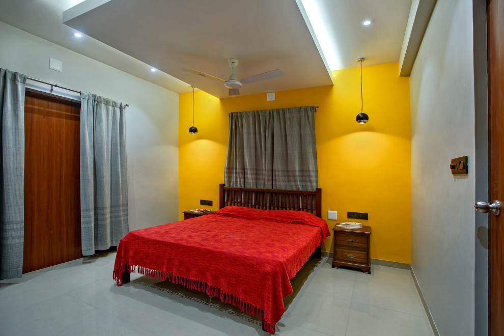This is an example of a contemporary bedroom in Ahmedabad.