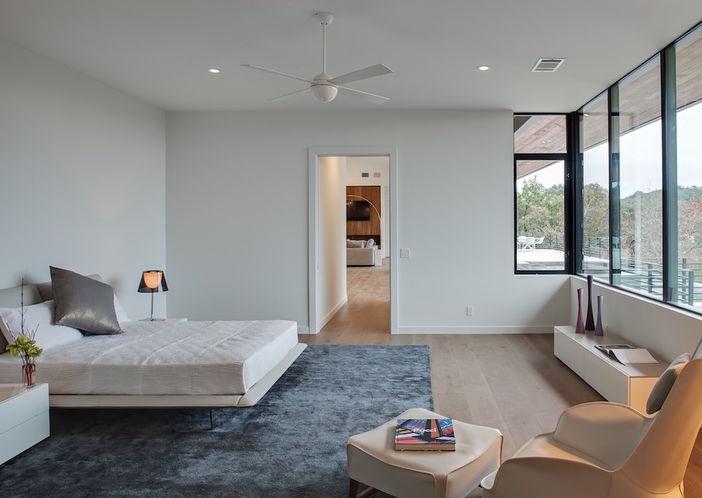 Photo of a modern bedroom in Austin.
