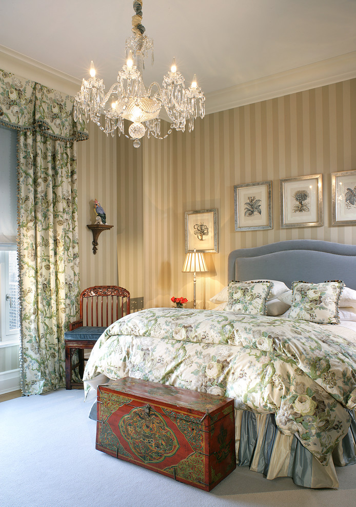 Ornate bedroom photo in New York with beige walls