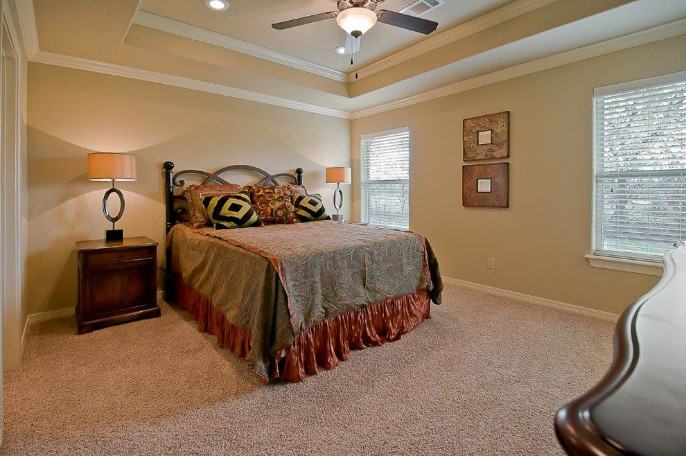 Elegant master carpeted bedroom photo in Other with beige walls