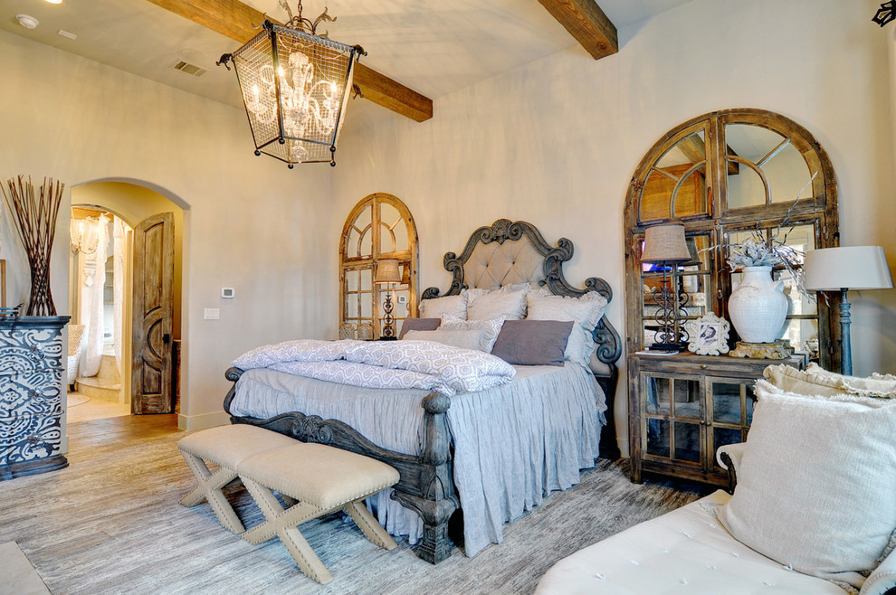 This is an example of a mediterranean bedroom in Dallas with white walls.