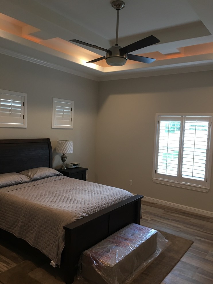 Bedroom - mid-sized traditional master porcelain tile bedroom idea in Austin with gray walls