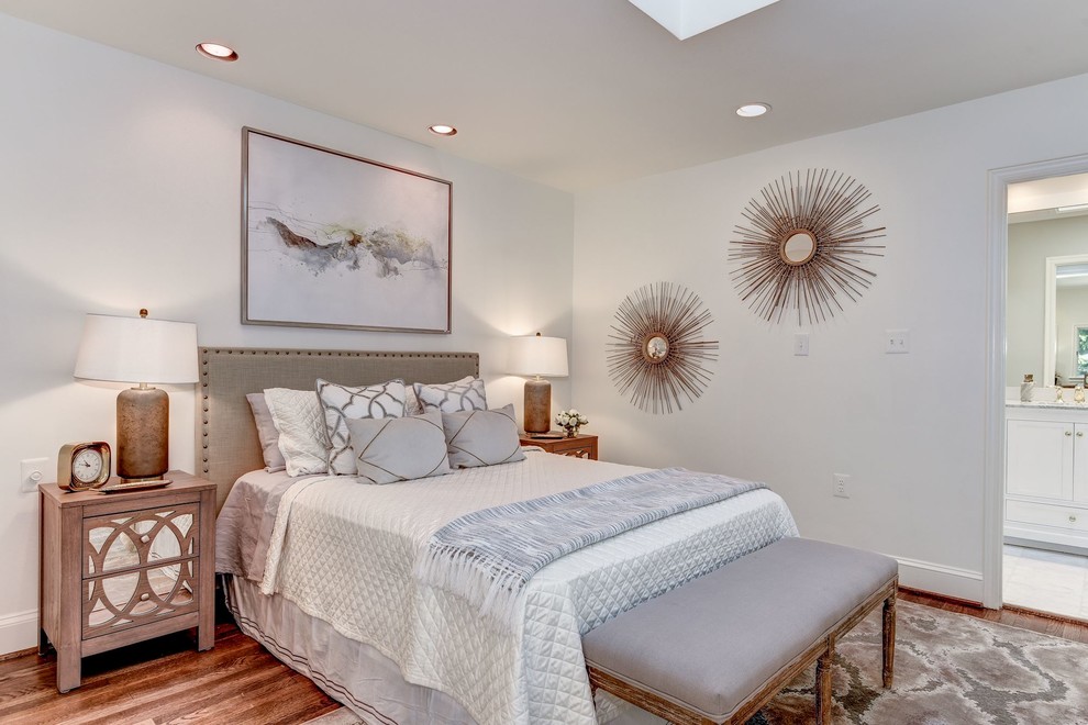 Classic master and grey and brown bedroom in DC Metro with white walls, dark hardwood flooring and brown floors.