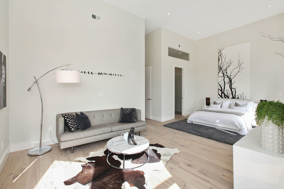 Design ideas for a large contemporary master bedroom in San Francisco with white walls and light hardwood flooring.