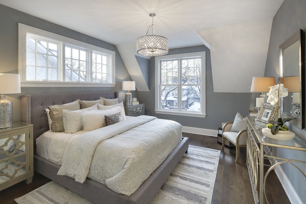 Classic bedroom in Minneapolis with grey walls and dark hardwood flooring.