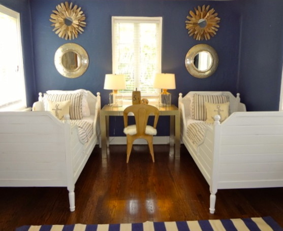 Photo of a medium sized beach style guest bedroom in San Francisco with blue walls, dark hardwood flooring and no fireplace.