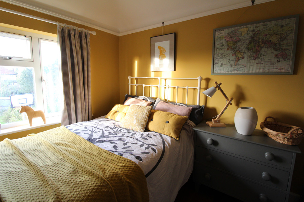 Inspiration for a small scandi guest and grey and yellow bedroom in Cambridgeshire with yellow walls, dark hardwood flooring, a standard fireplace and a tiled fireplace surround.
