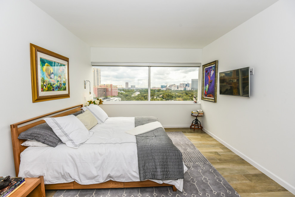 Foto de dormitorio principal vintage de tamaño medio con paredes blancas, suelo de baldosas de porcelana y suelo gris