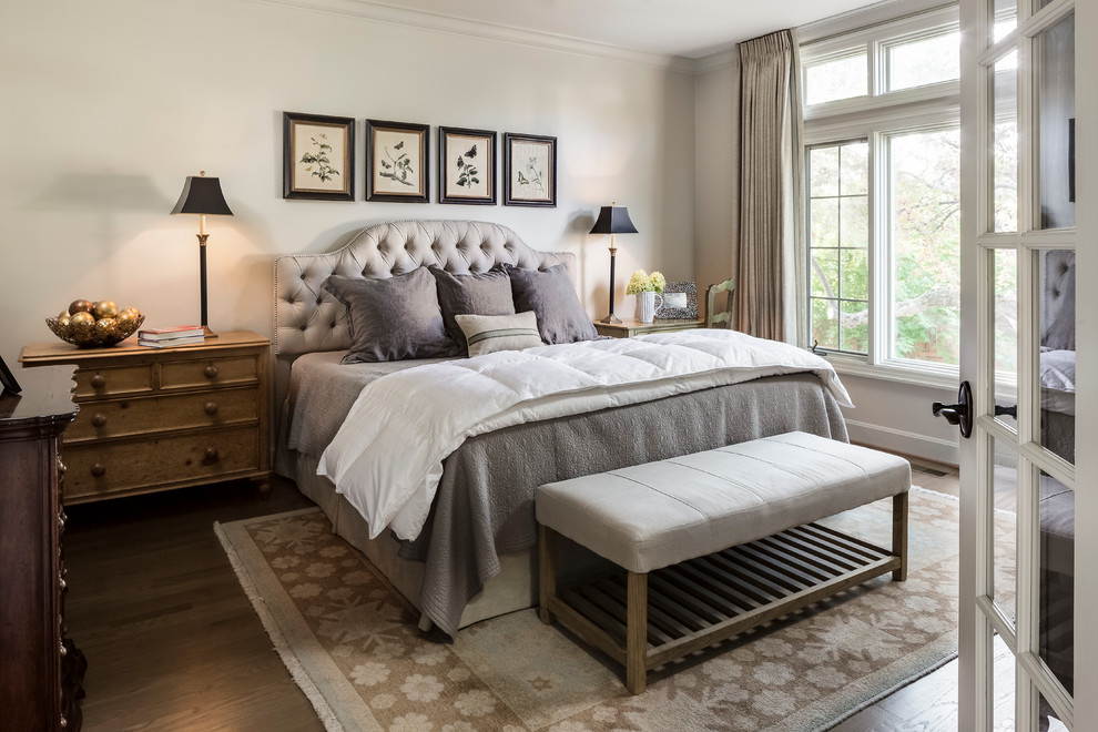Inspiration for a mid-sized timeless master light wood floor bedroom remodel in Kansas City with beige walls and no fireplace