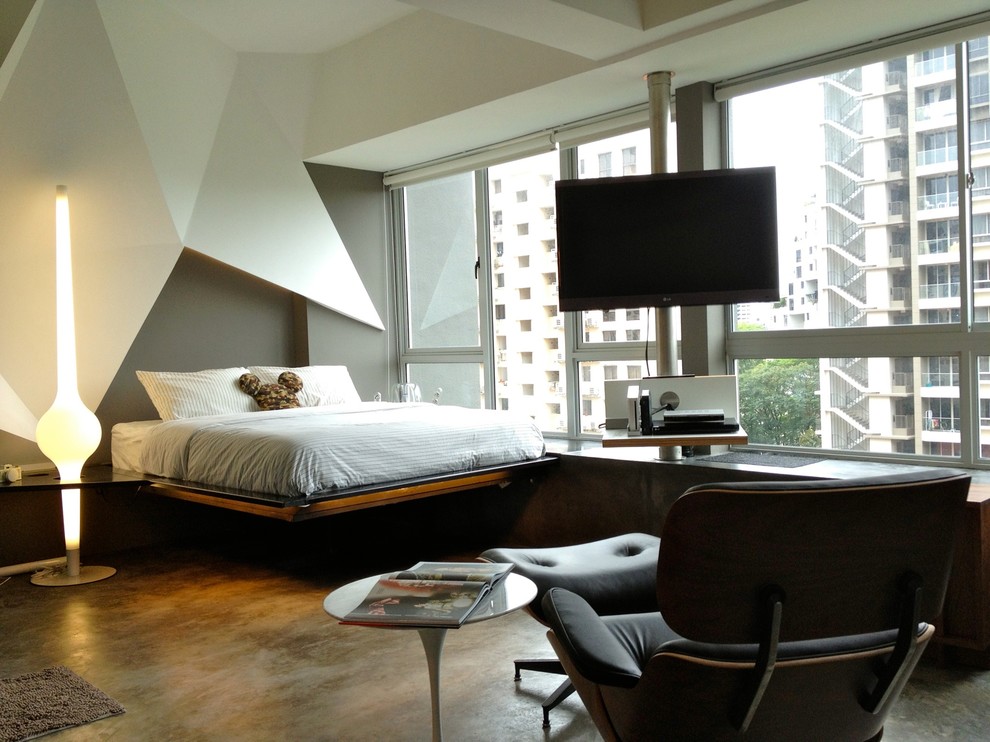 Imagen de dormitorio pequeño con suelo de cemento