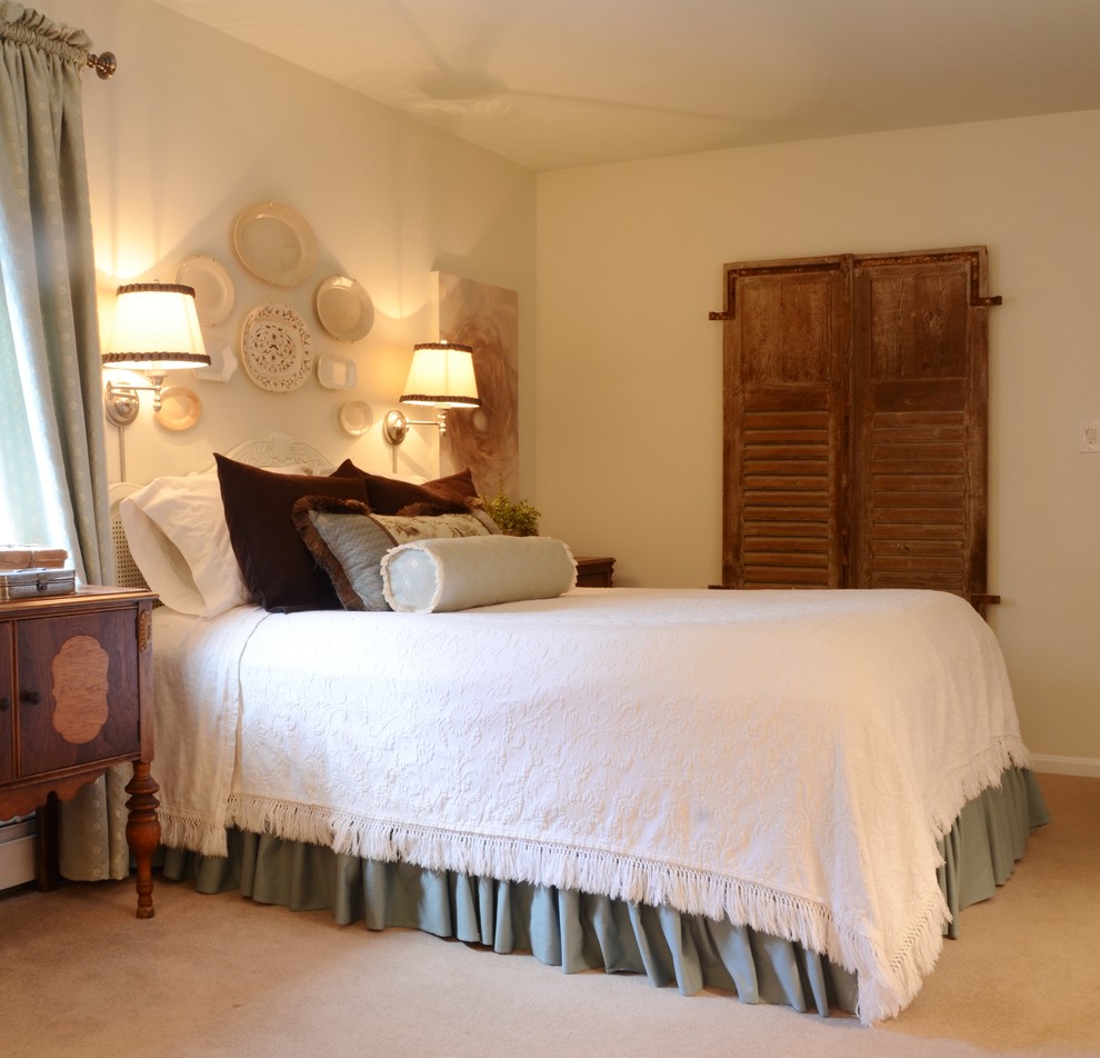 Example of a classic carpeted bedroom design in Philadelphia with beige walls