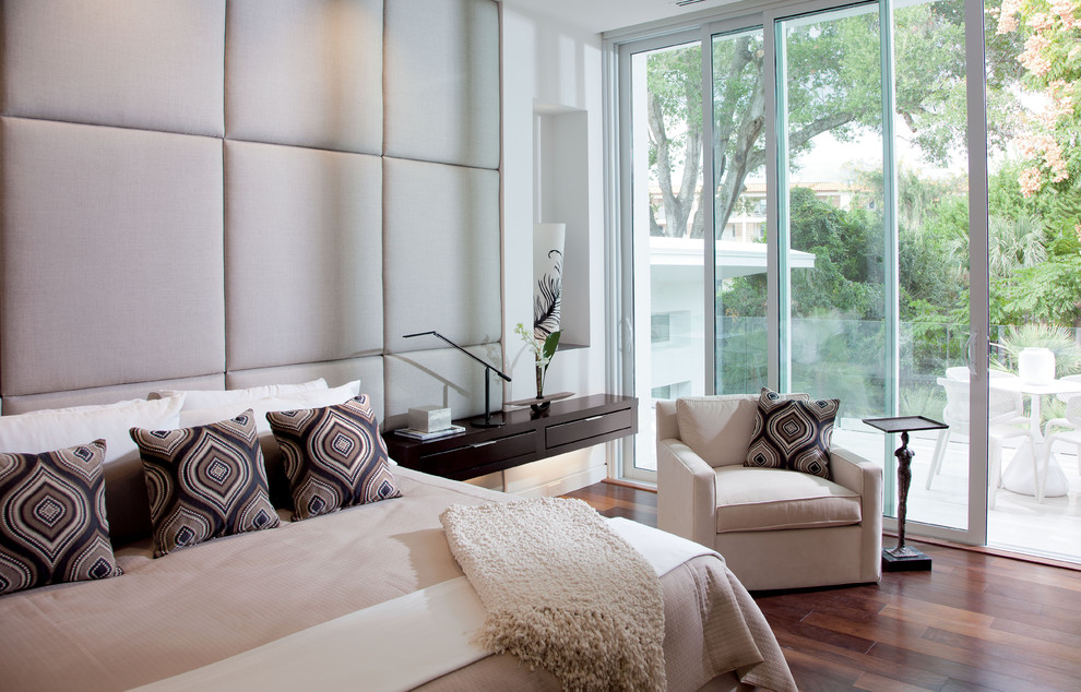 Design ideas for a contemporary bedroom in Orlando with dark hardwood flooring.