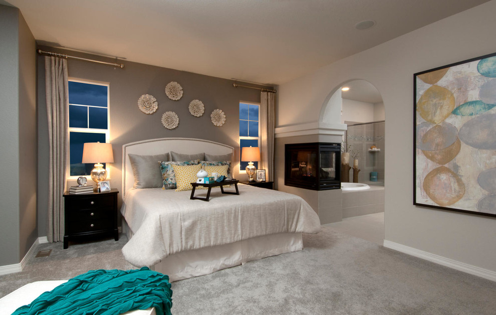Bedroom - large contemporary master carpeted bedroom idea in Denver with gray walls, a two-sided fireplace and a tile fireplace