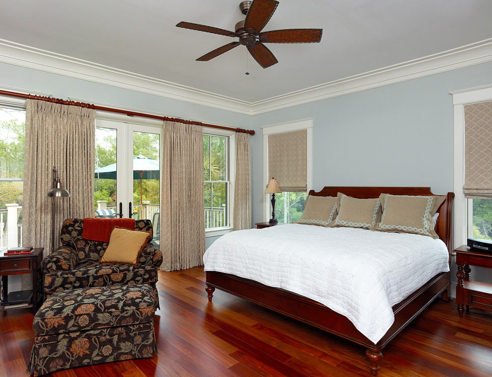Design ideas for a traditional master bedroom in Charleston with blue walls.