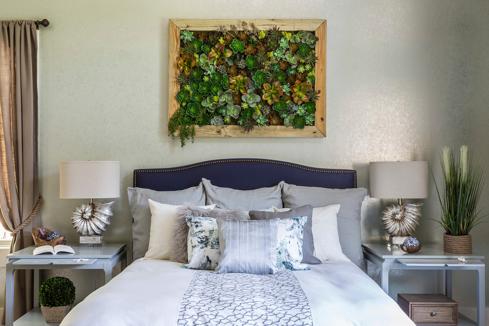 Mid-sized elegant guest light wood floor bedroom photo in New York with green walls and no fireplace