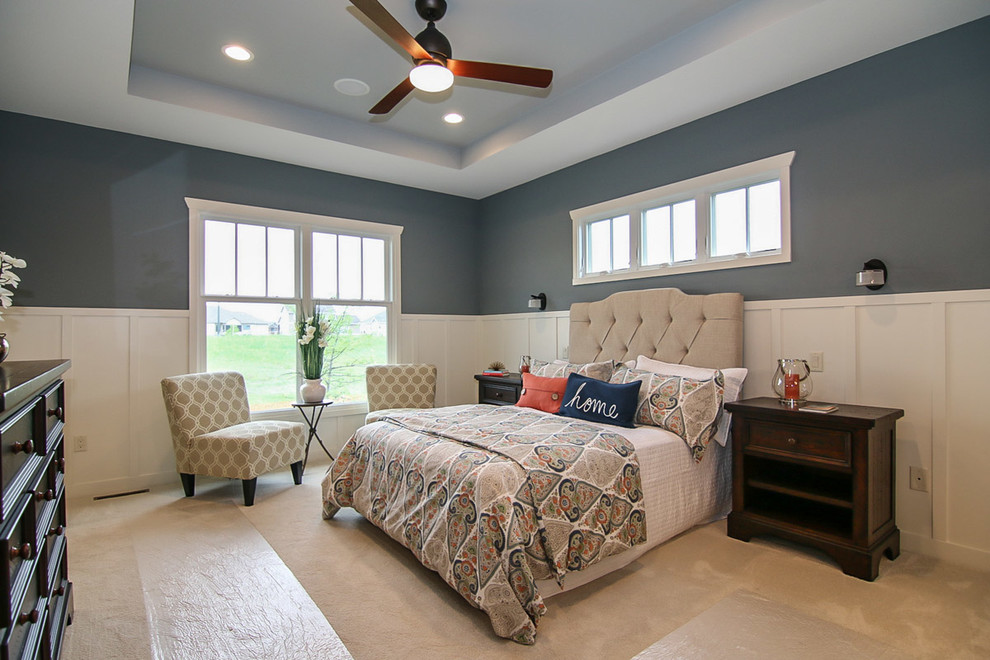 Design ideas for a large classic master bedroom in Milwaukee with blue walls and carpet.