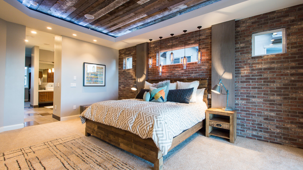 Inspiration for an industrial bedroom in Salt Lake City with beige walls, carpet and a feature wall.