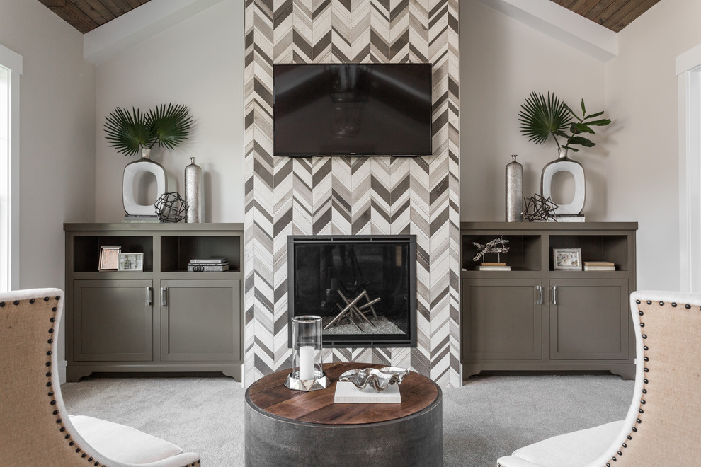 Example of a large transitional master carpeted and gray floor bedroom design in Indianapolis with beige walls, a standard fireplace and a tile fireplace
