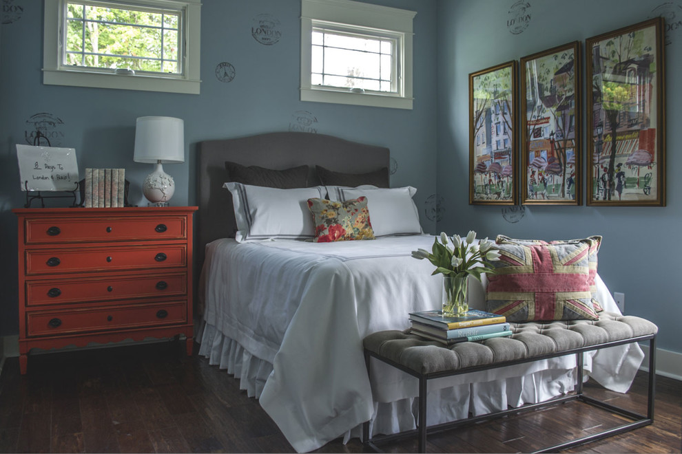 Example of a mid-sized guest medium tone wood floor and brown floor bedroom design in Louisville with blue walls