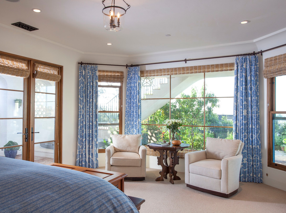 Photo of a medium sized mediterranean master bedroom in San Diego with white walls and carpet.