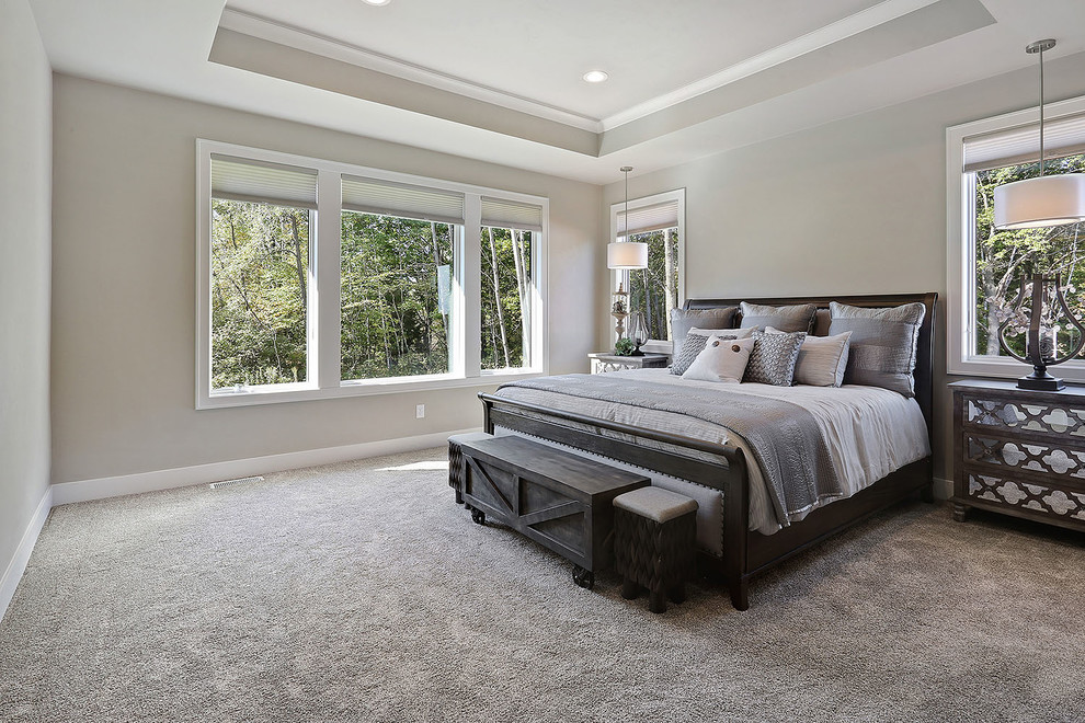 Photo of a classic master bedroom in Other with carpet.