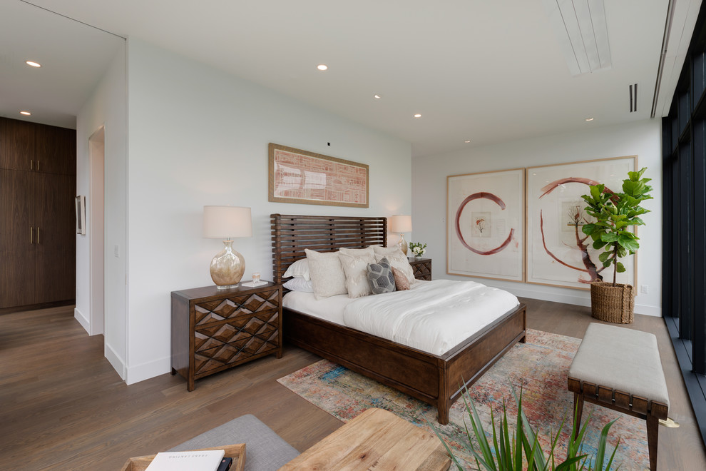 Inspiration for a large modern master light wood floor and gray floor bedroom remodel in Minneapolis with white walls