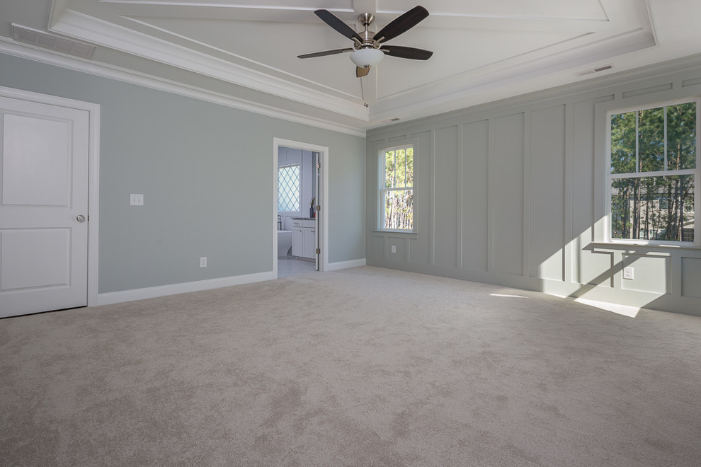 Inspiration for a medium sized country master bedroom in Raleigh with grey walls, carpet, no fireplace and white floors.