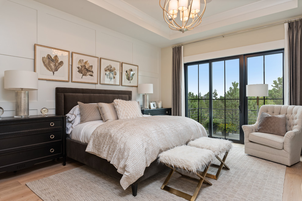 Photo of a classic grey and brown and grey and silver bedroom in Denver with beige walls, light hardwood flooring and beige floors.