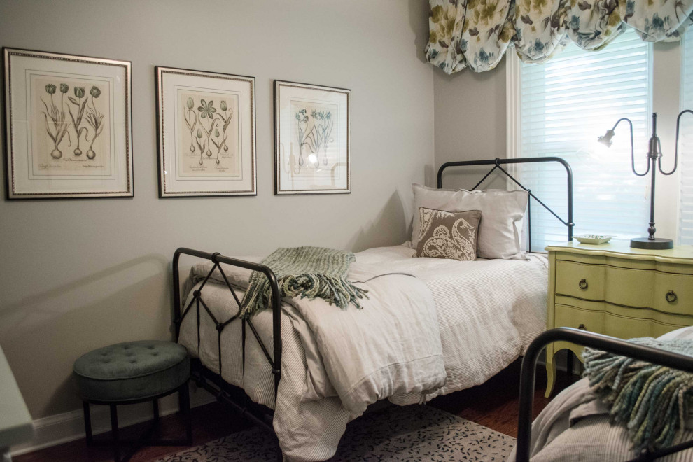 Bedroom - small guest medium tone wood floor bedroom idea in Louisville with gray walls